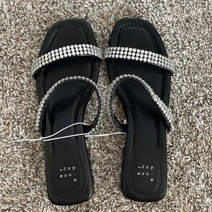 Black sandal with small heel to straps, black rhinestone in size 8